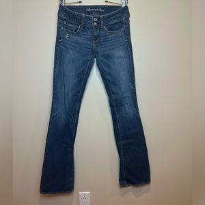 American Eagle. Stretch, bootcut, medium wash, lightly distressed. Size 0L.